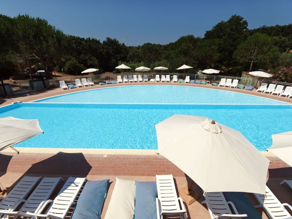 Water, Sky, Property, Swimming Pool, Azure, Outdoor Furniture, Shade, Tree, Leisure, Seaside Resort