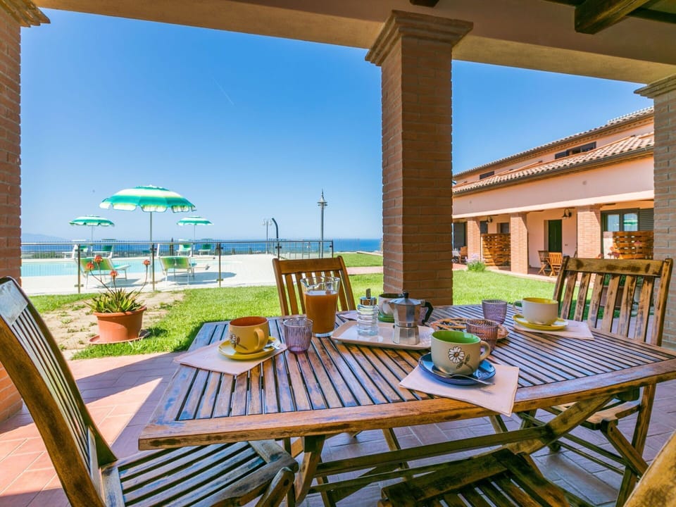 Plant, Sky, Furniture, Table, Water, Property, Building, Chair, Azure, Seaside Resort