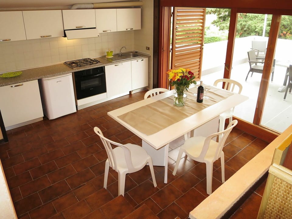 Furniture, Property, Table, Cabinetry, Window, Countertop, Plant, Sink, Wood, Lighting