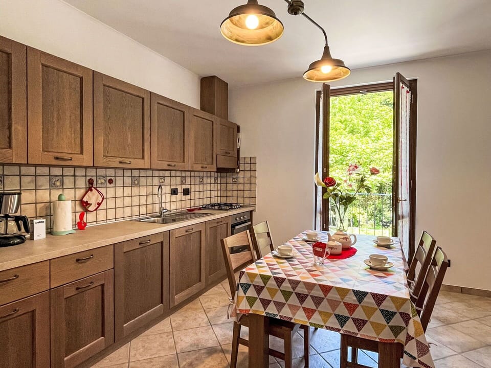 Cabinetry, Furniture, Property, Countertop, Table, Wood, Interior Design, Chair, Lighting, Kitchen