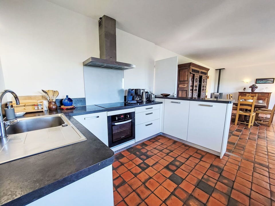 Kitchen, Countertop, Flooring, Kitchen Appliance, Floor, Interior Design, Cabinetry, Furniture, Major Appliance, Kitchen Stove