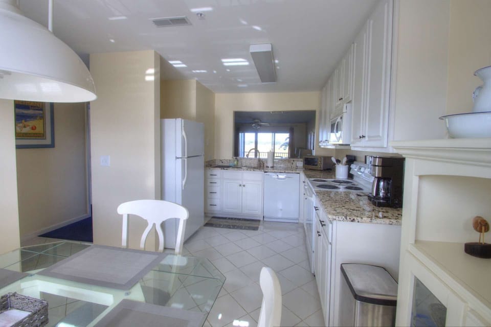 Gorgeous granite eat-in kitchen with views of the bay.