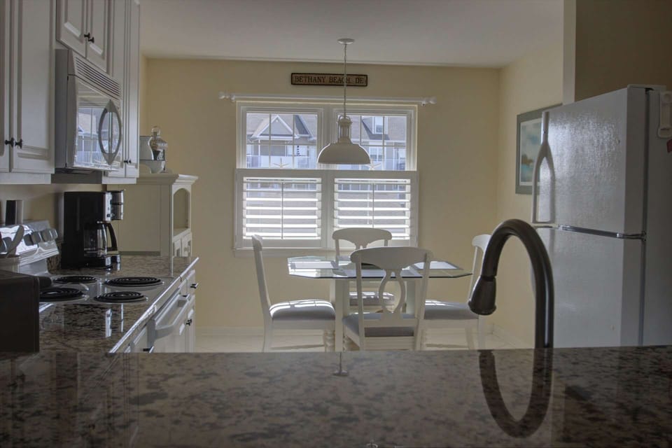 Kitchen table seats four comfortably for any meal.