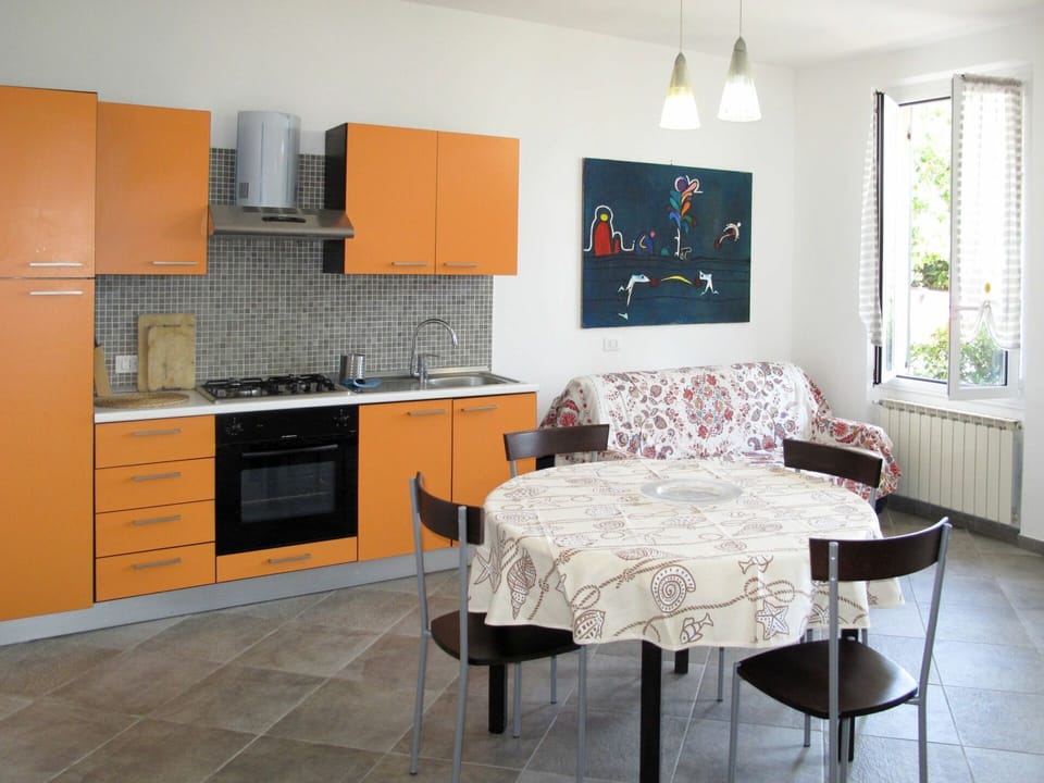 Furniture, Room, Orange, Property, Interior Design, Kitchen, Floor, Cabinetry, Wall, Building
