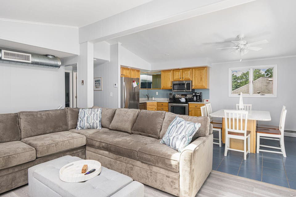 Living room area with Queen Sleep Sofa, open into Kitchen
