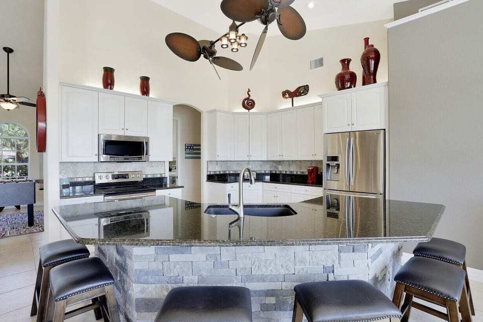 Huge Granite center Island area with stool seating for 6