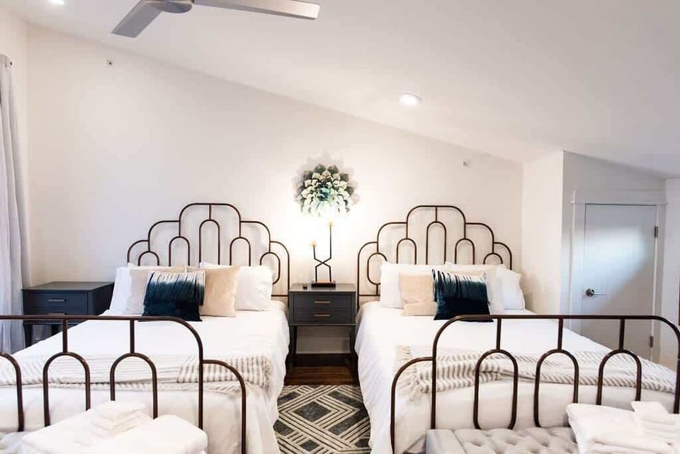 Ascend to the top floor to discover a spacious double queen bedroom awaiting you.