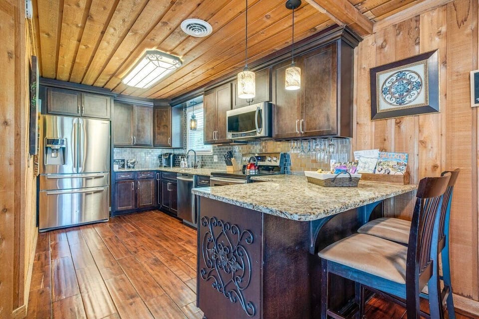 A kitchen meant to be used. Updated appliances, generous counter space, and a thoughtfully stocked collection of dishes, cookware, and serving pieces make dining in effortless.