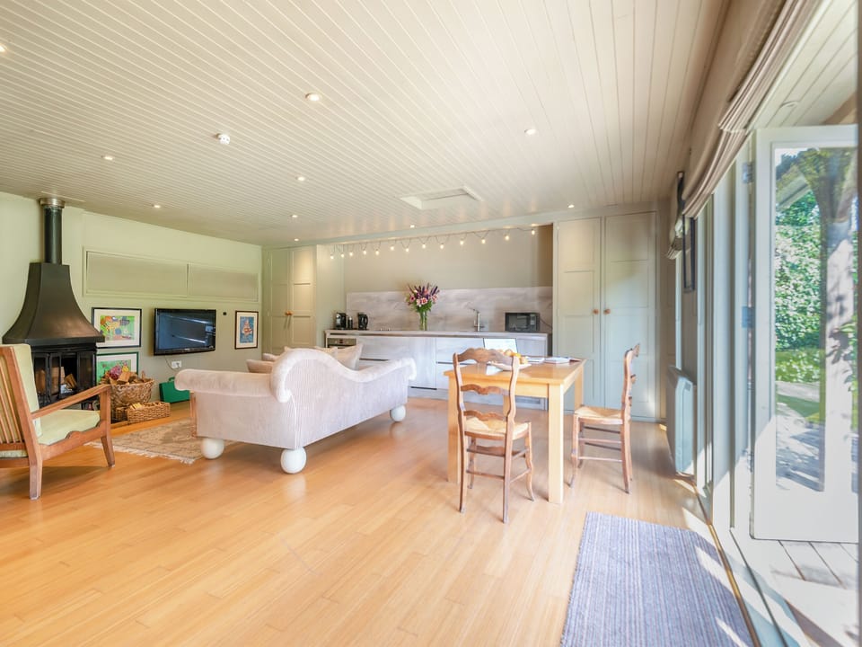 Cosy living area with wood burner | Lymington Lodge, Lymington