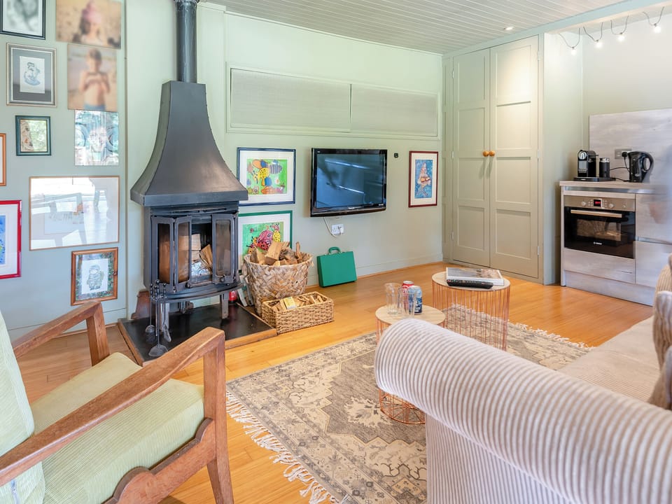 Cosy living area with wood burner | Lymington Lodge, Lymington