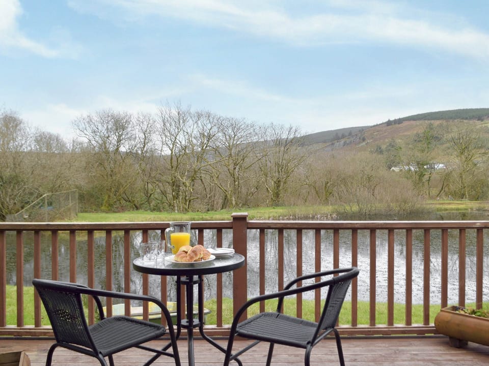Terrace with wonderful views | Herons Log Cabin, Rosebush