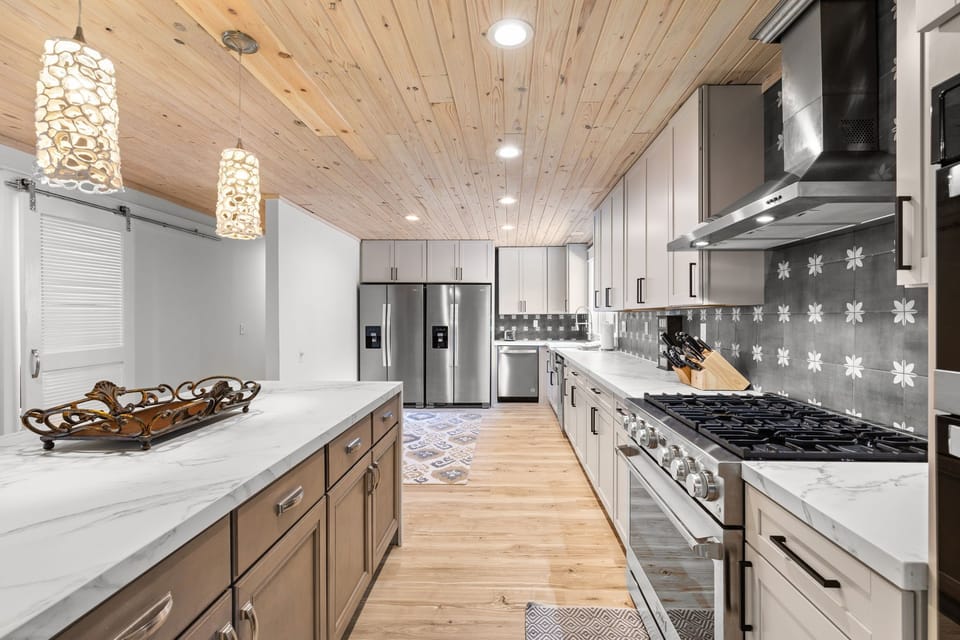 large spacious kitchen w 36 inch gas range and addtl 30 inch electric oven