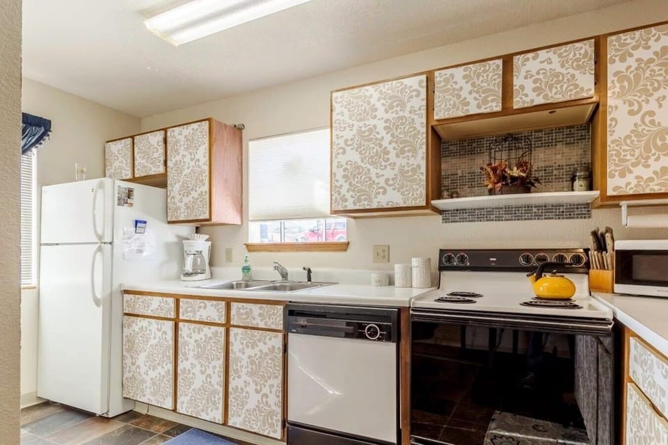 Kitchen equipped with full size Appliances.