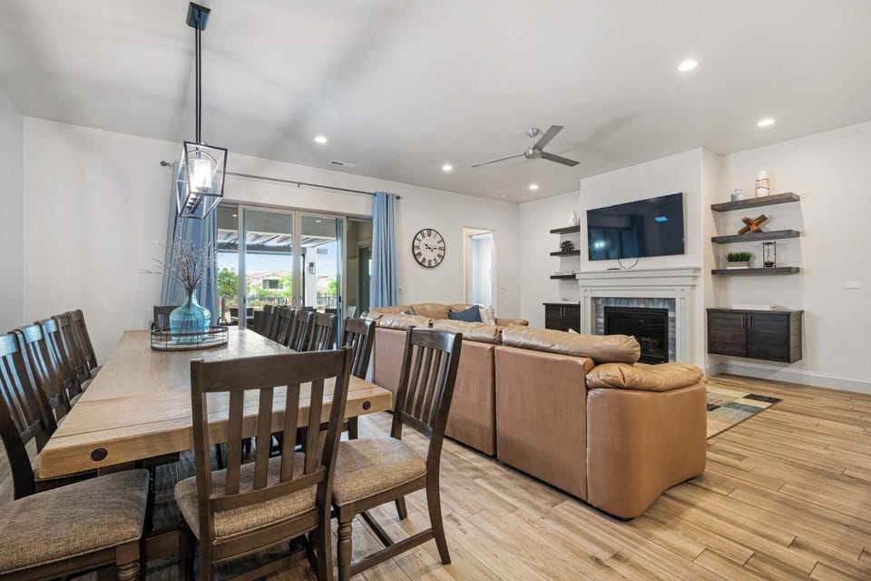 Main floor living room with sofa seating, fireplace, and a smart TV