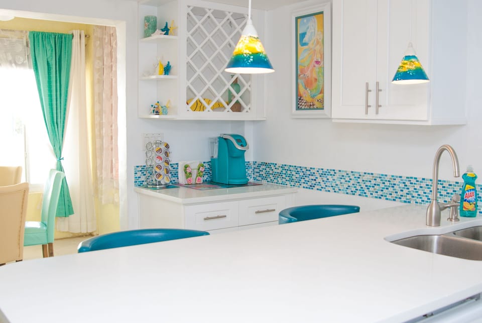 Full kitchen downstairs with beach views