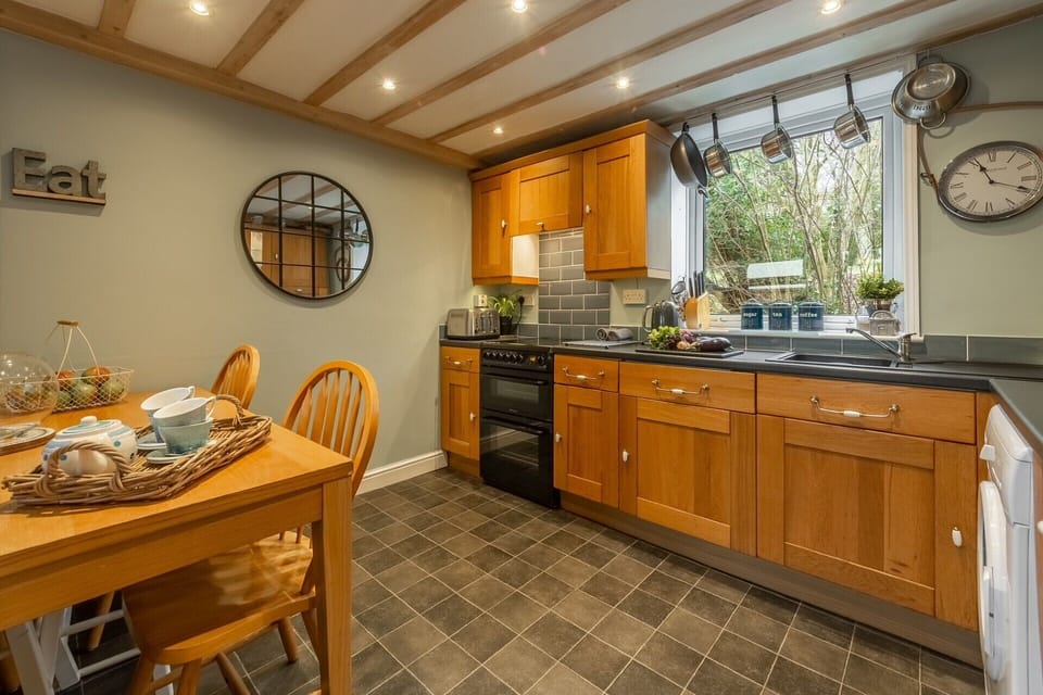 Kitchen. 6 seater table, washer/dryer, dish washer, fridge with freezer box.
