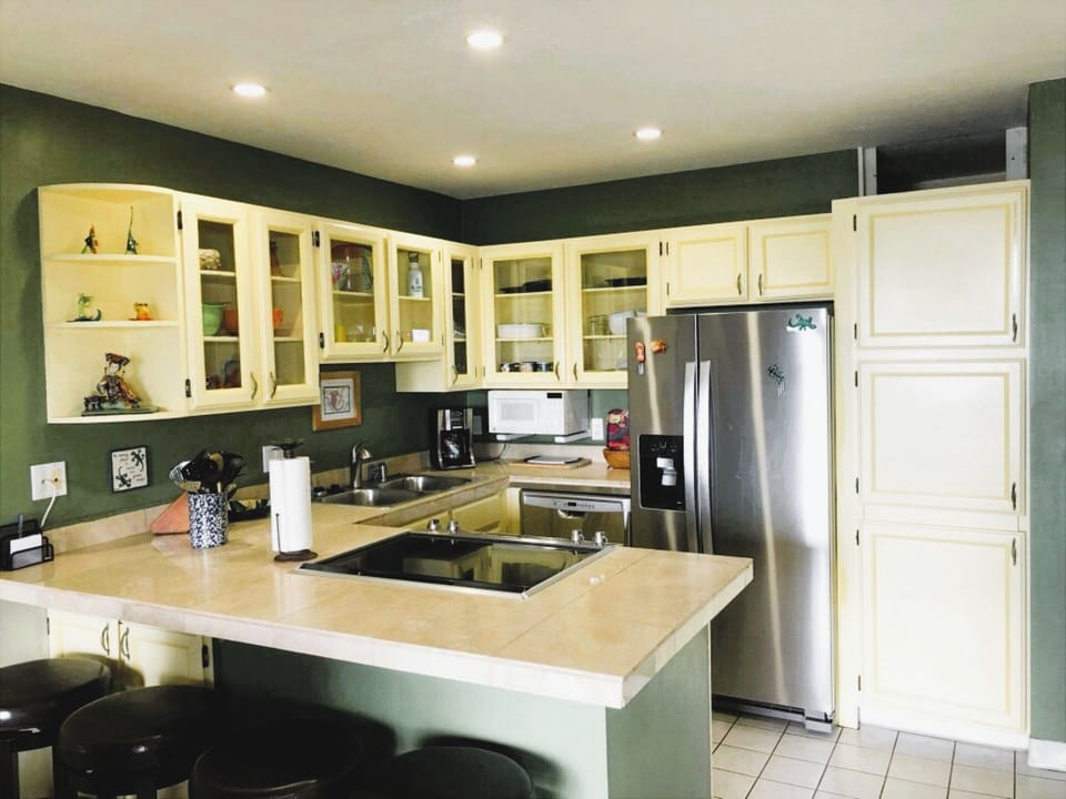 Fully equipped kitchen has stainless appliances.
