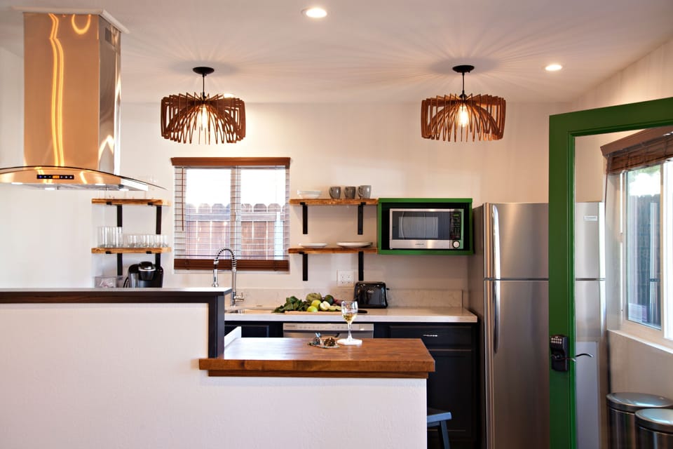 17. Unit 1’s Modern Gallery Kitchen Opens to the Main Living Area.