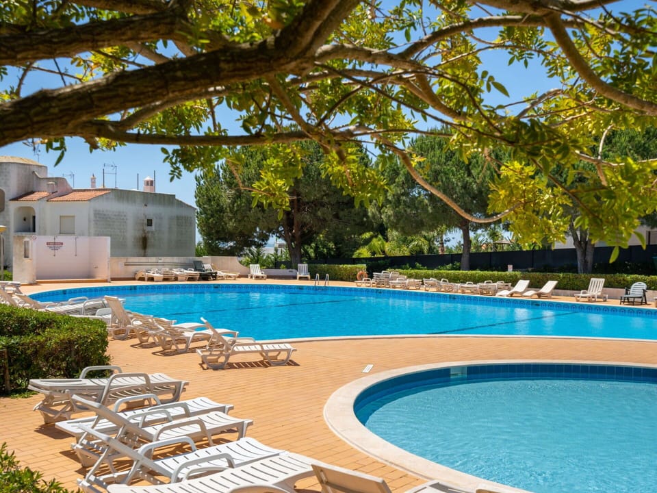 Water, Plant, Property, Swimming Pool, Sky, Nature, Azure, Shade, Outdoor Furniture, Tree