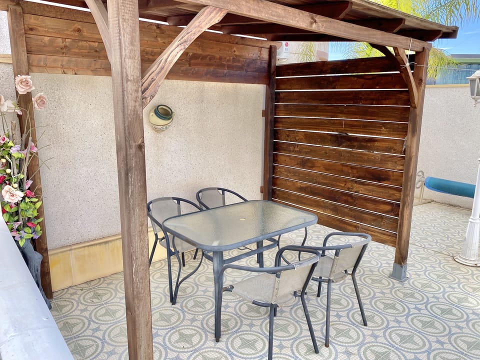 shaded dining area next to BBQ