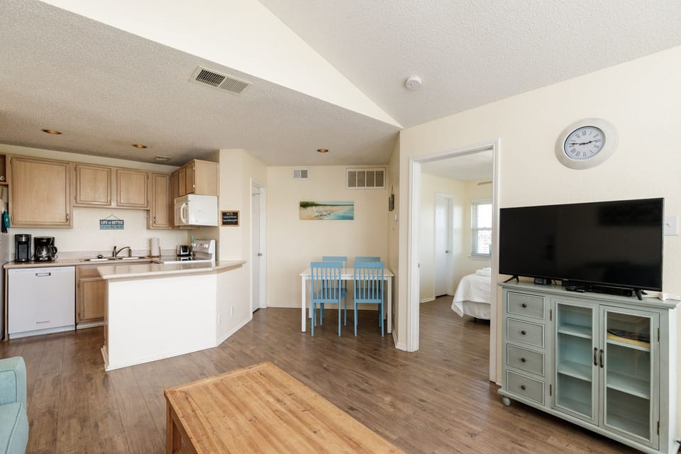 Share meals and laughter in the stylish kitchen, dining and living area, enhanced by the coastal ambiance