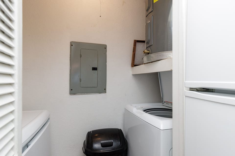 Washer and dryer in condo next to kitchen