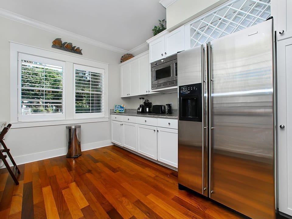 Wide galley kitchen with high end appliances, granite counter tops and a fully equipped kitchen.