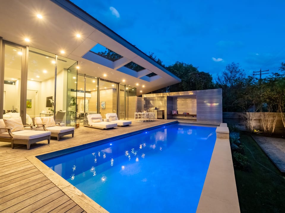 Amazing outdoor area with pool, seating and grill
