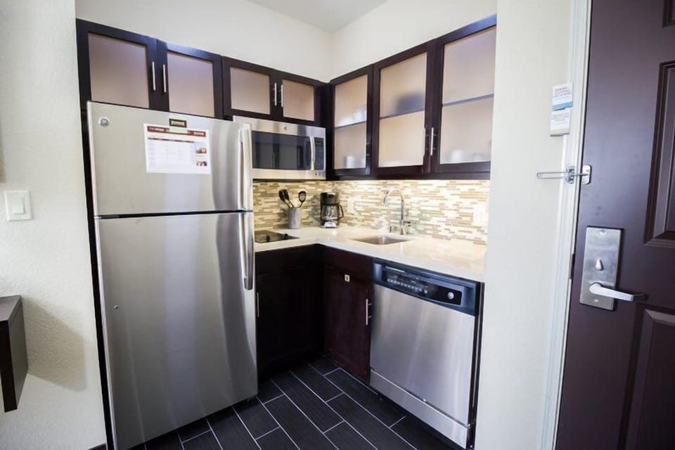 Full kitchen with stainless steel appliances