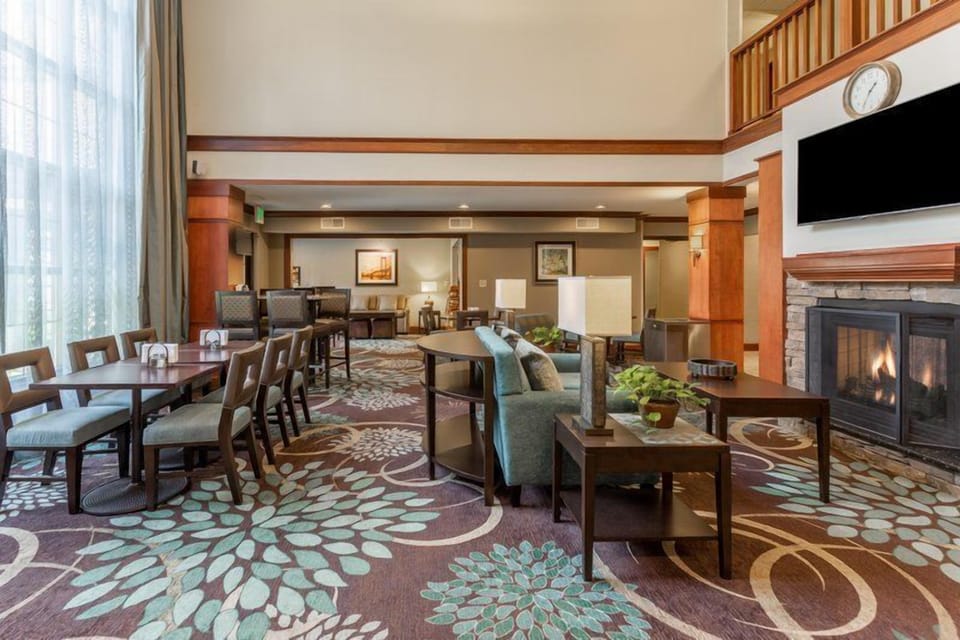 Unwind in a spacious lounge area, featuring modern décor and a warm ambiance.