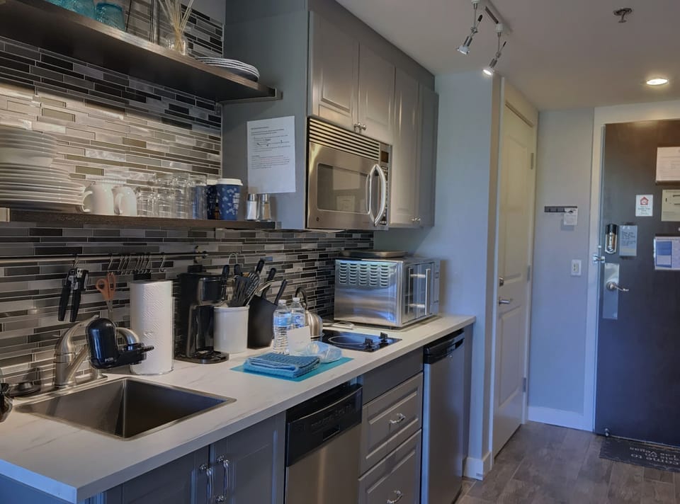 Small fridge located below counter.