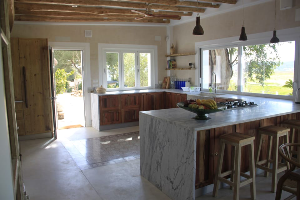 Kitchen with 2 ovens and 2 dishwashers