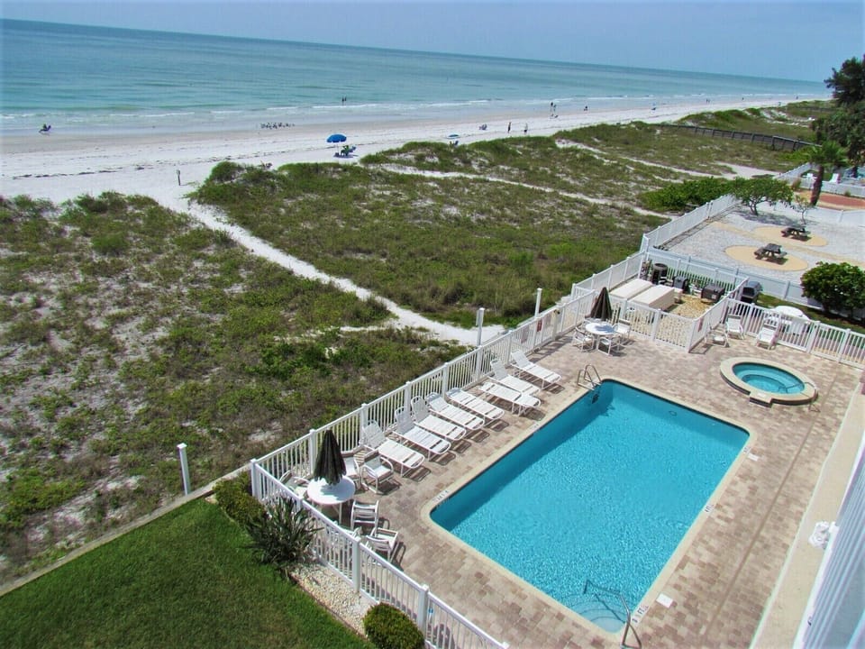Beachfront Pool and Hot Tub View From The Top Floor Condo - Indian Rocks Beach and The Complex's Beachfront Pool + Hot Tub. Relax By The Pool Or Walk Down To The Gulf!