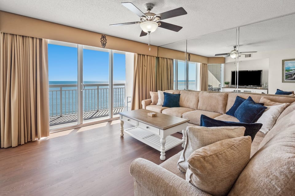 Living area with balcony doors and an ocean view at Crescent Shores 1303 in Crescent Beach, North Myrtle Beach