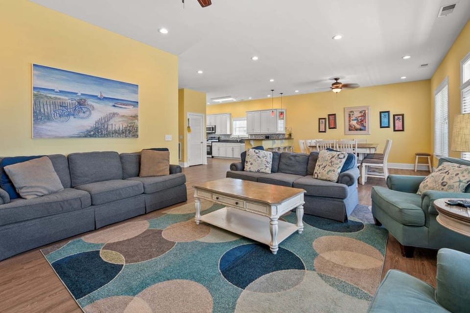 Sitting area opening to the dining table and kitchen at Another Day in Paradise in Cherry Grove, North Myrtle Beach