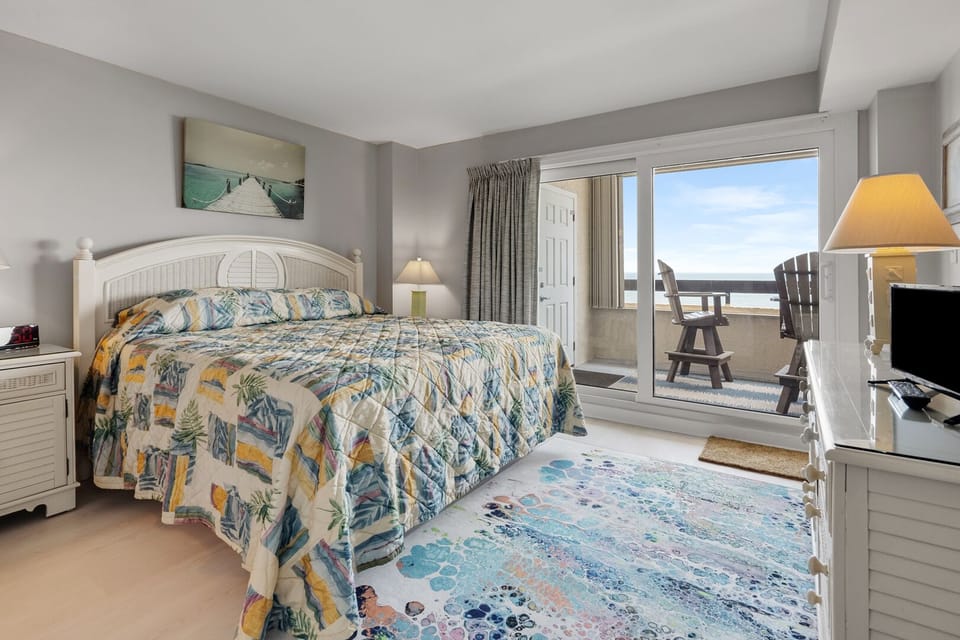 Bedroom opening to a balcony with ocean views at Sea Pointe 807, a 3-bedroom Cherry Grove condo rental