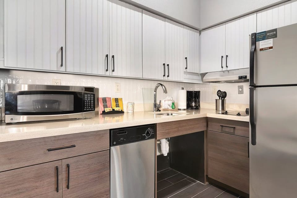 Whip up your favorite meals with modern appliances and ample counter space in this fully-equipped kitchen.
