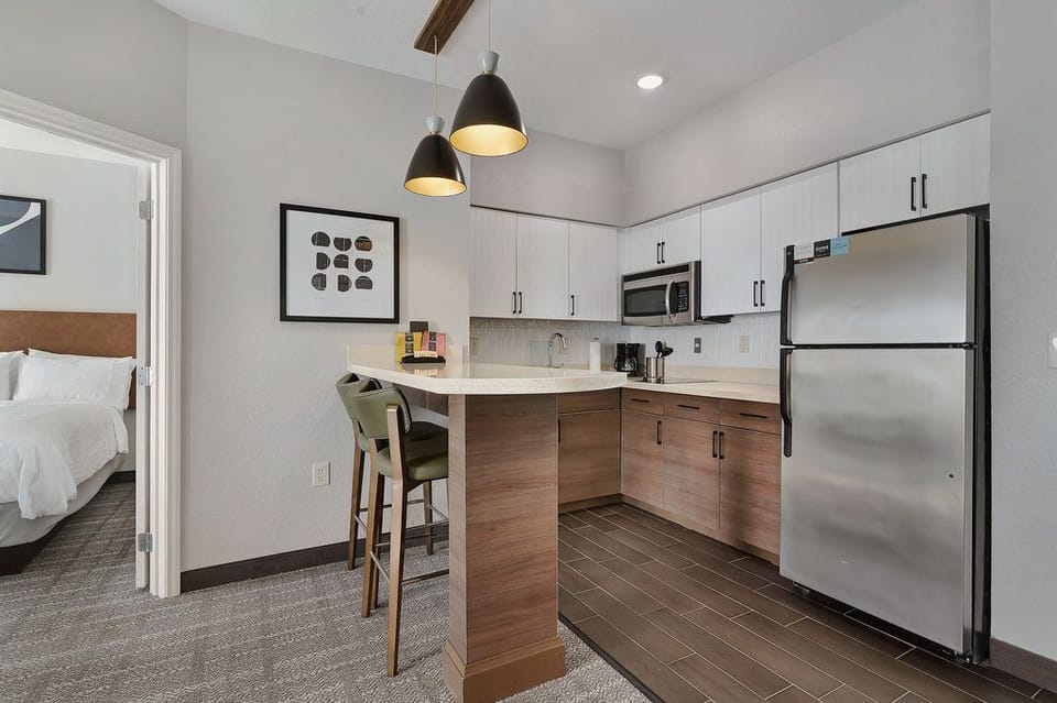 Cook and dine in this modern kitchen, complete with stainless steel appliances and stylish seating for casual meals.