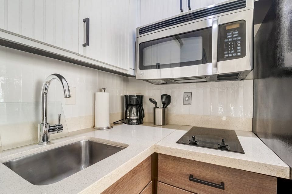 Cook up a storm in a sleek kitchen equipped with stainless steel appliances.
