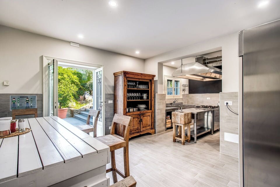 Furniture, Flooring, Interior Design, Kitchen, Floor, Wood, Countertop, Ceiling, Wood Flooring, Cabinetry