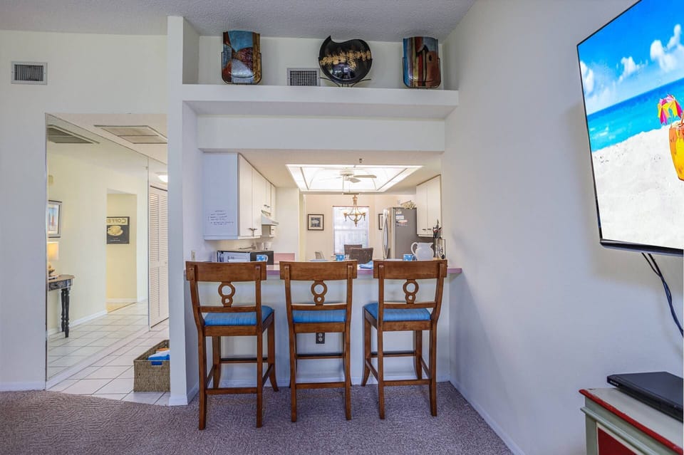 Kitchen bar counter seating for 3 plus out door dining on the lanai