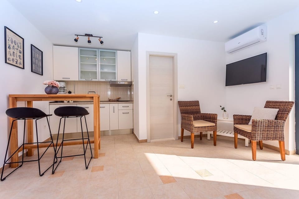 The lower ground floor offers summer kitchen with a lounge corner 