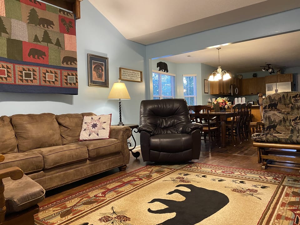 Living rm adjoins dining area & open to kitchen. Native wildlife photos thru out