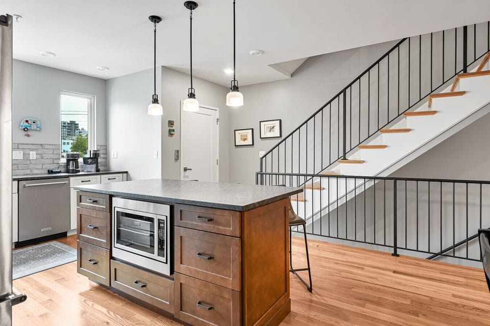 High-end appliances and ample lighting and windows in the kitchen