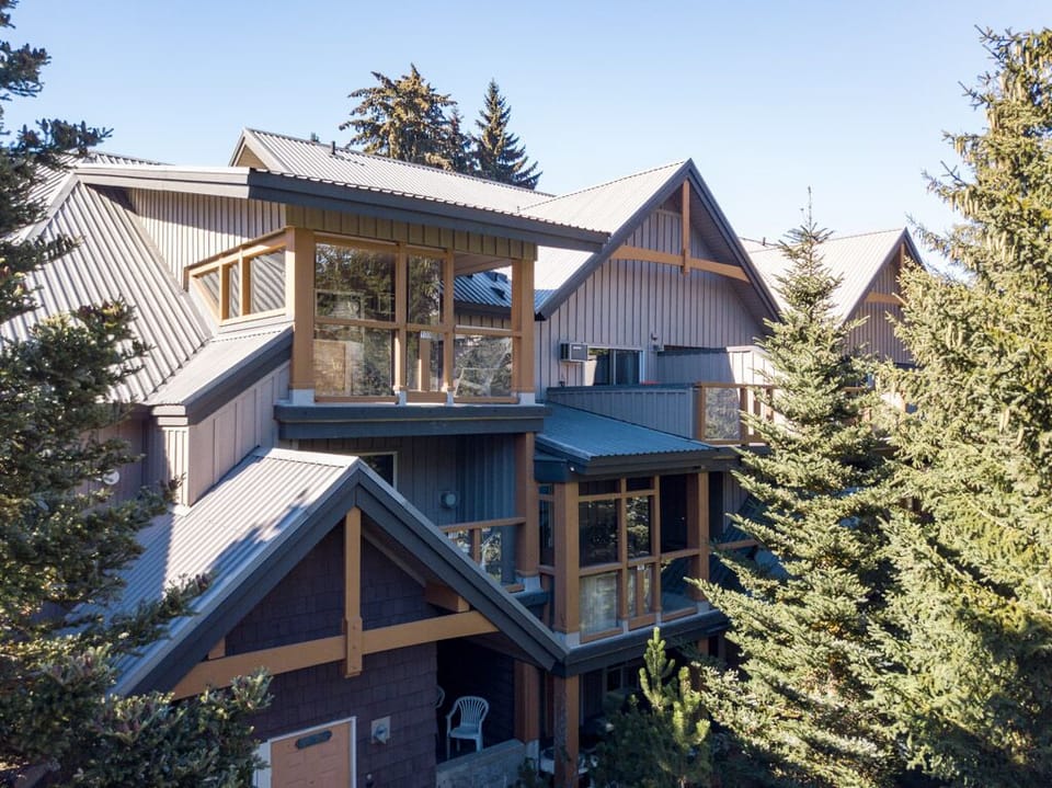 Exterior of 90 Glaciers Reach - Exterior of 90 Glaciers Reach.  The private hot tub is on a covered deck on the second floor.  The third floor deck is off the master bedroom.