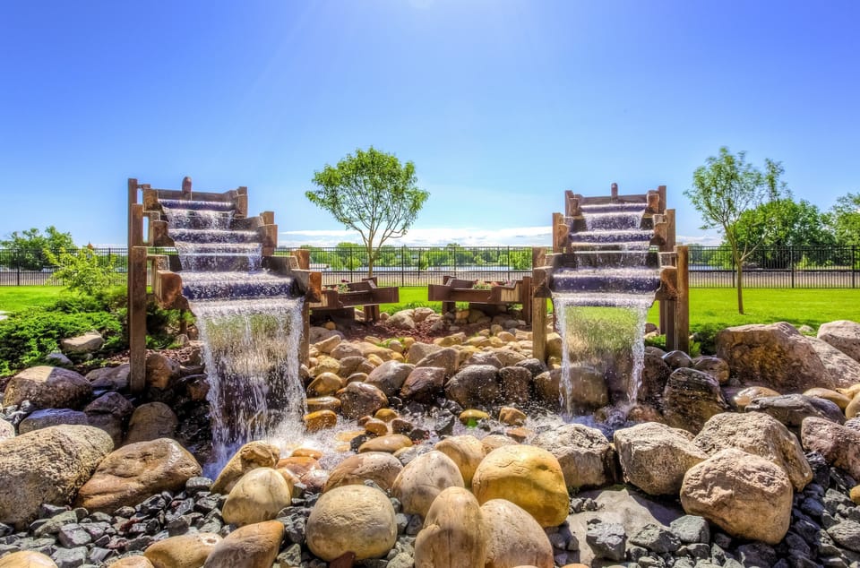 Relax and unwind by the soothing twin waterfalls, surrounded by natural beauty.