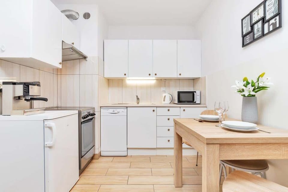 The sleek design of the kitchenette blending seamlessly with the living area.