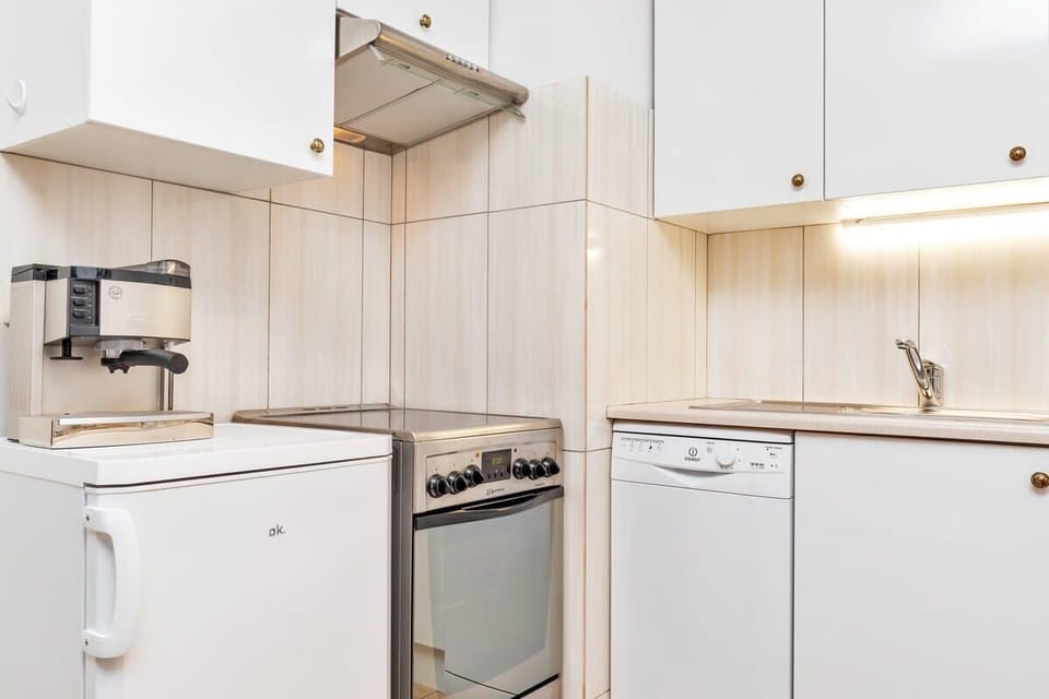 The kitchenette's practical layout maximizes space and functionality.