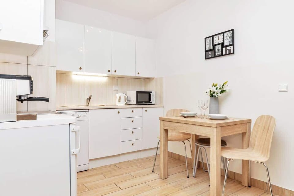 A stylish dining table with chairs, which is ideal for family meals or remote work.
