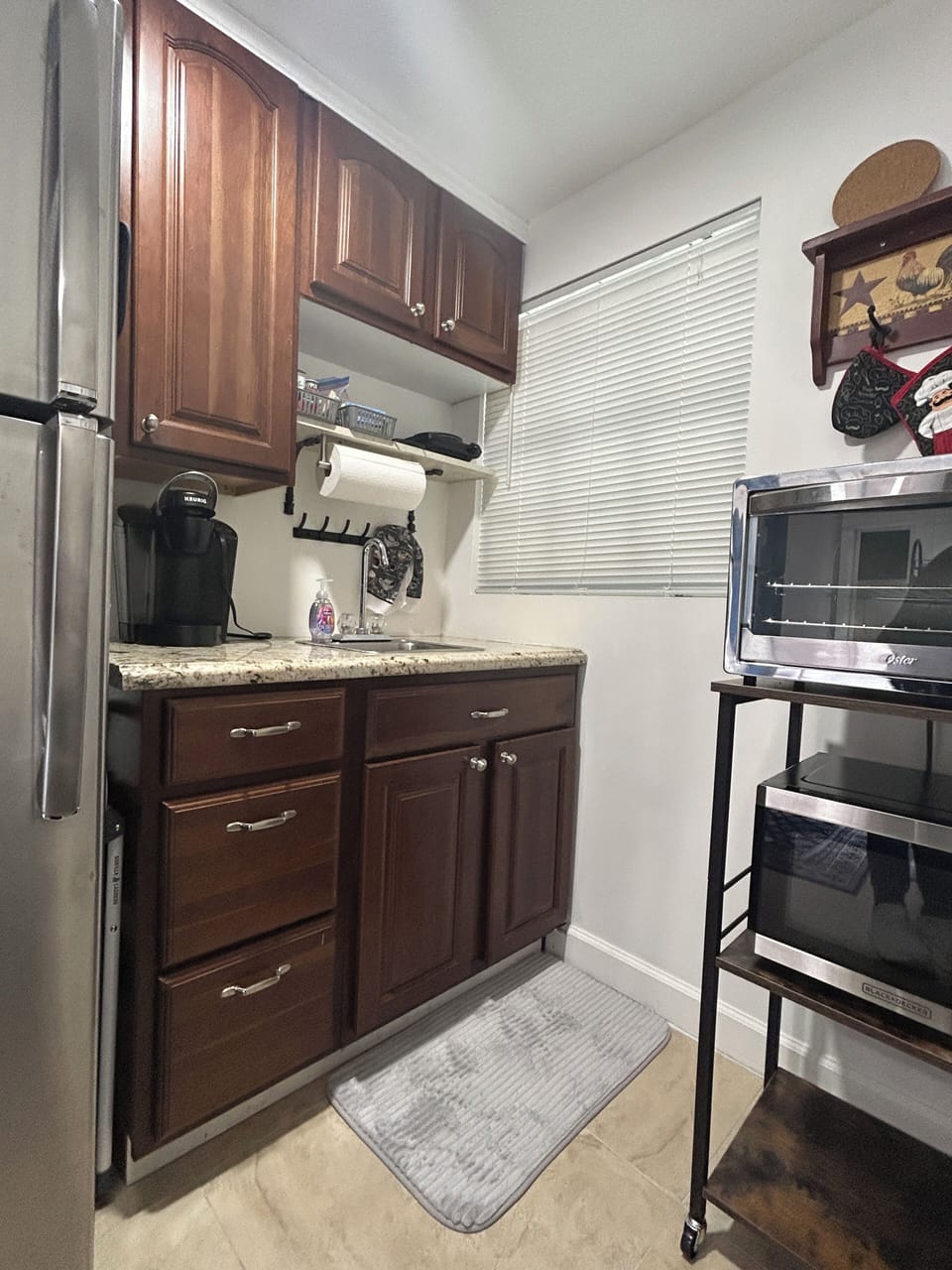 Kitchen area with full size refrigerator